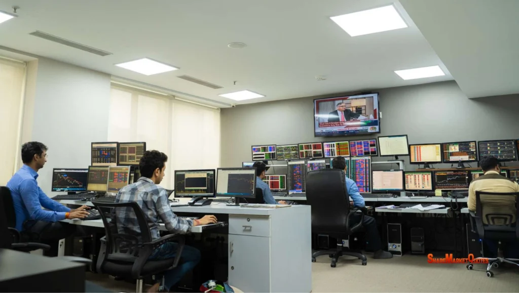Young Indian trader analyzing stock charts on a laptop with trading graphs in the background — beginner-level stock trading 2025